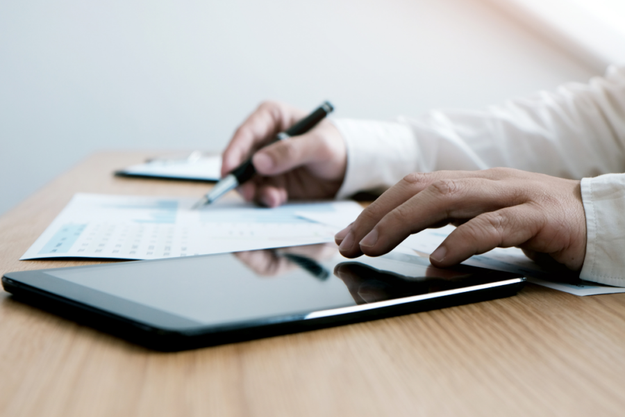 Property manager reviewing fire alarm inspection reports through an online compliance management portal