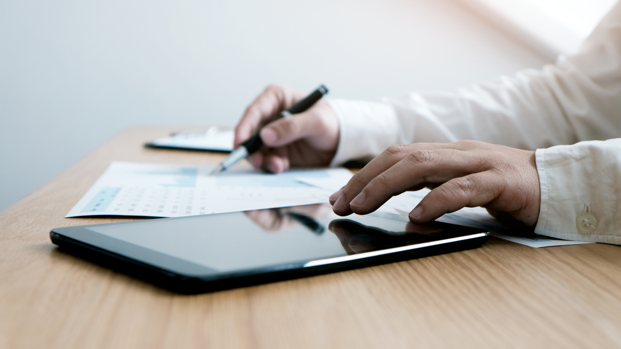 Property manager reviewing fire alarm inspection reports through an online compliance management portal