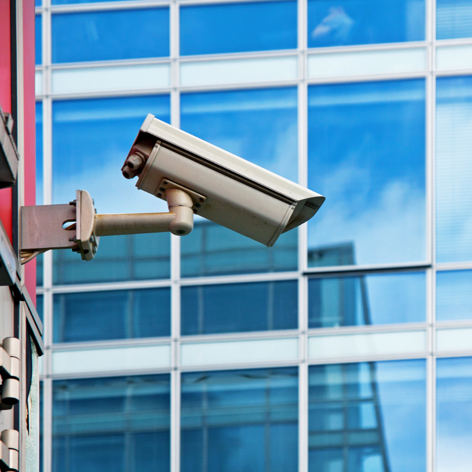 Integrated commercial security systems including surveillance and access control